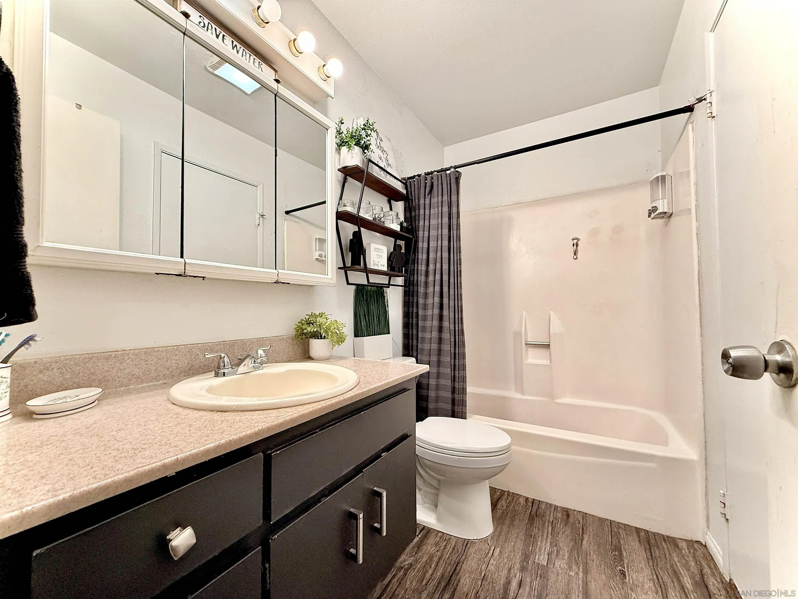 321 Sun Court El Cajon, CA 92021 - Photo 14 of 33 a bathroom with a granite countertop sink toilet and shower