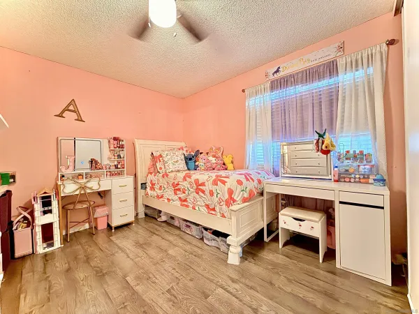 a bed room with a bed and a window