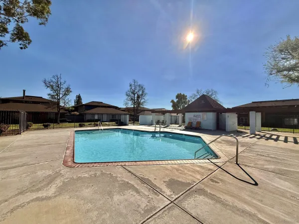 a view of swimming pool with chairs