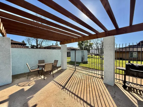 a view of a swimming pool with an outdoor seating