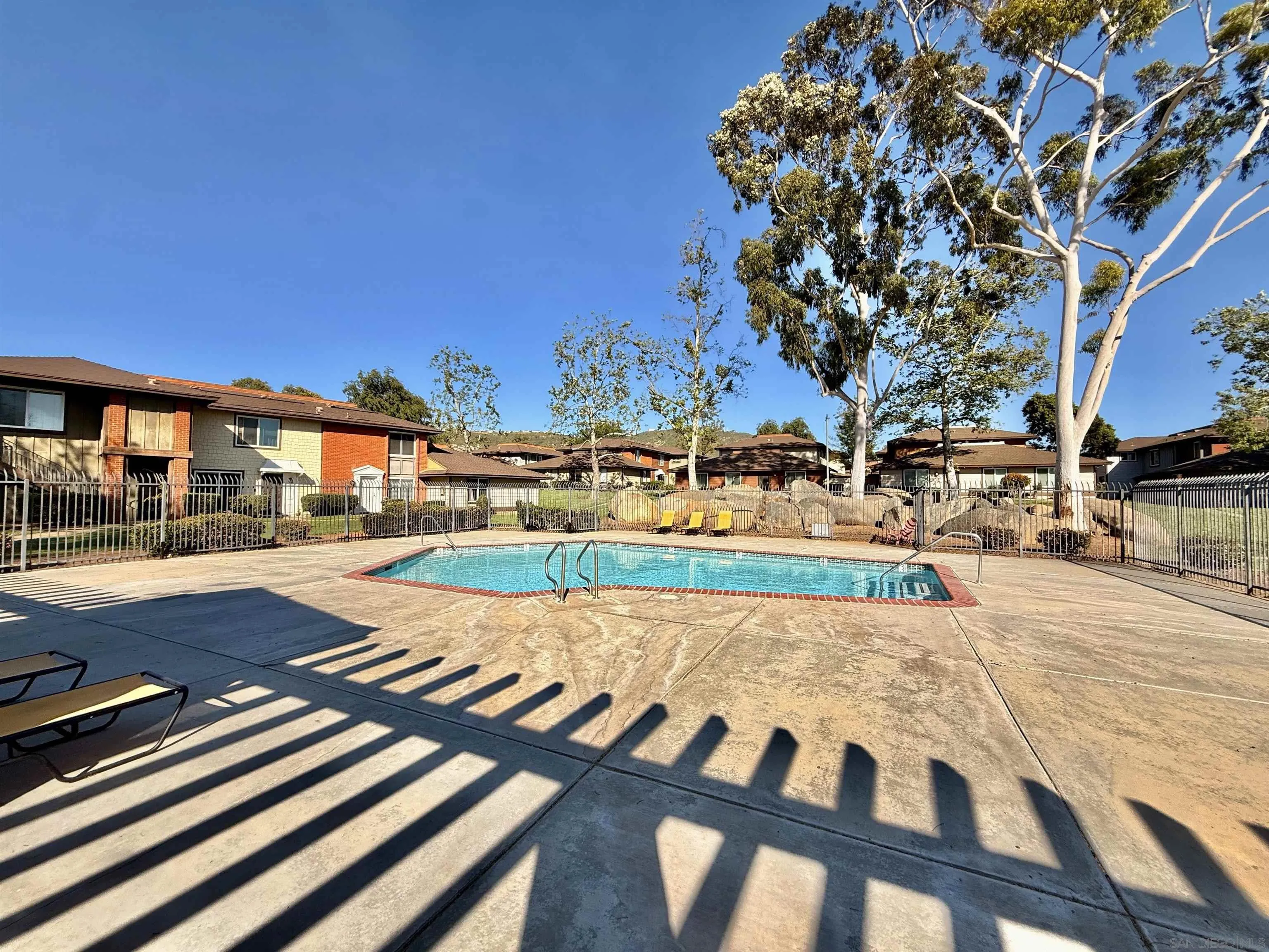 321 Sun Court El Cajon, CA 92021 - Photo 31 of 33 a view of a swimming pool with an outdoor seating