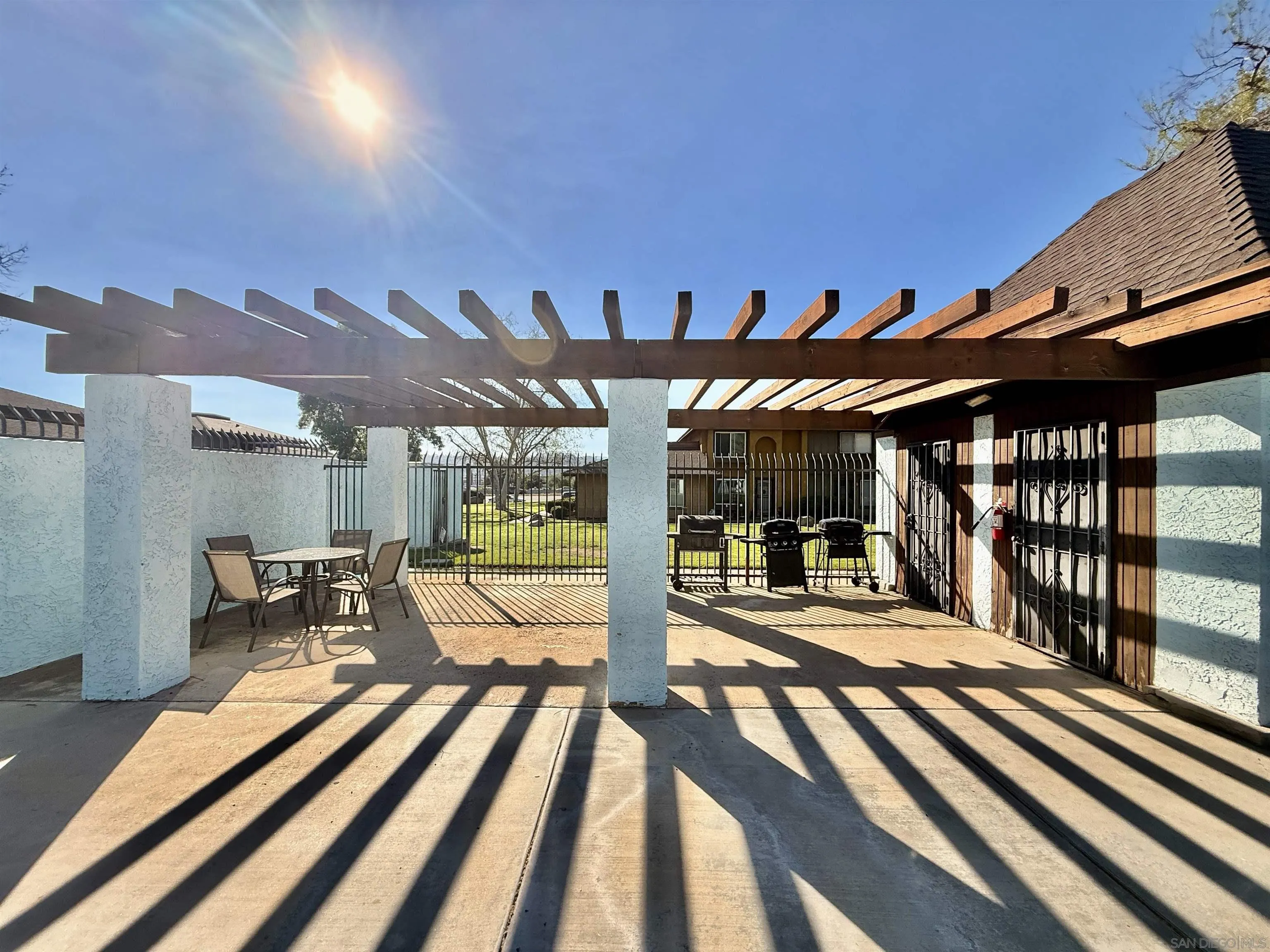 321 Sun Court El Cajon, CA 92021 - Photo 32 of 33 a view of a patio with a table and chairs