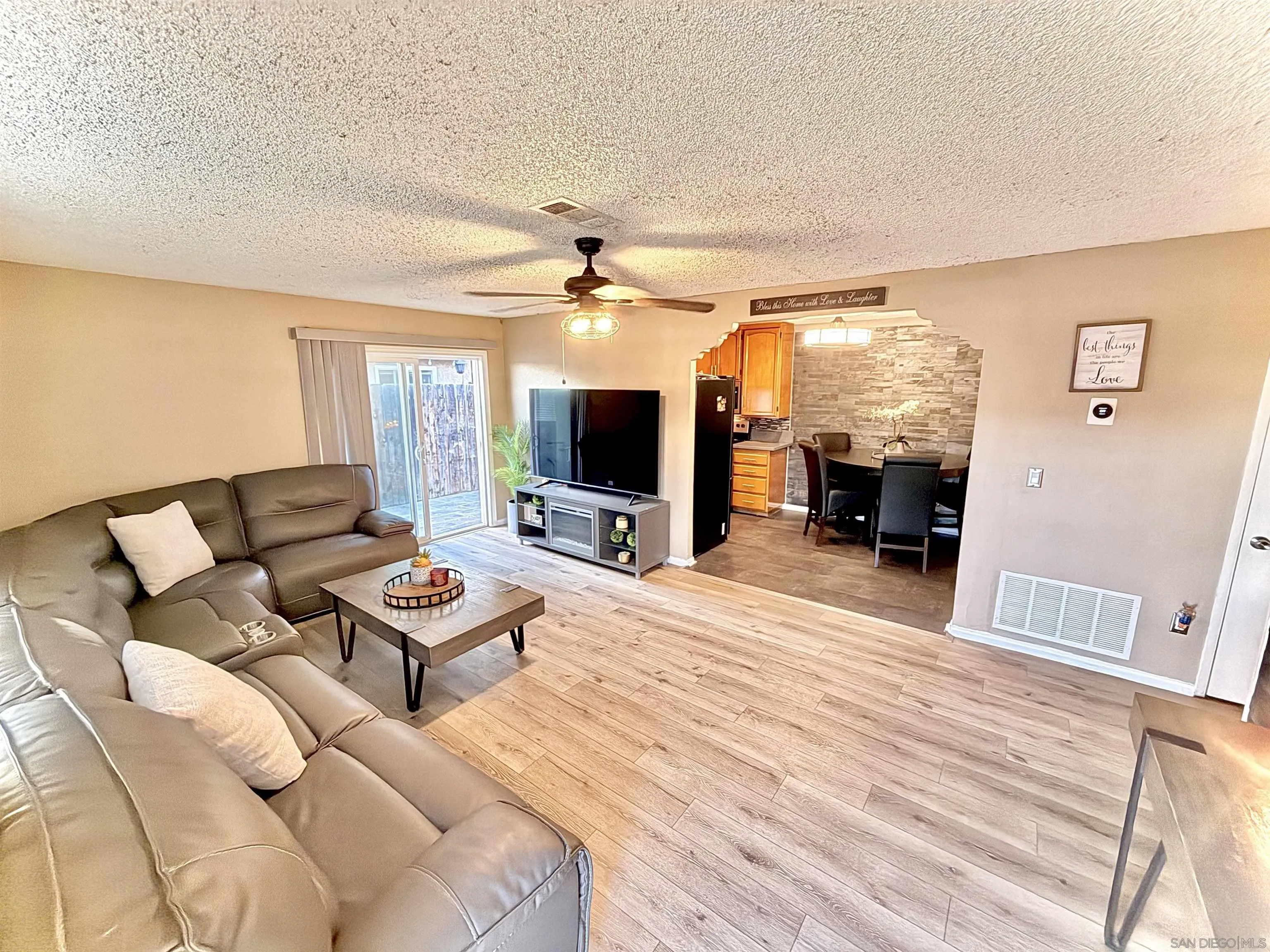 321 Sun Court El Cajon, CA 92021 - Photo 9 of 33 a living room with furniture and a flat screen tv