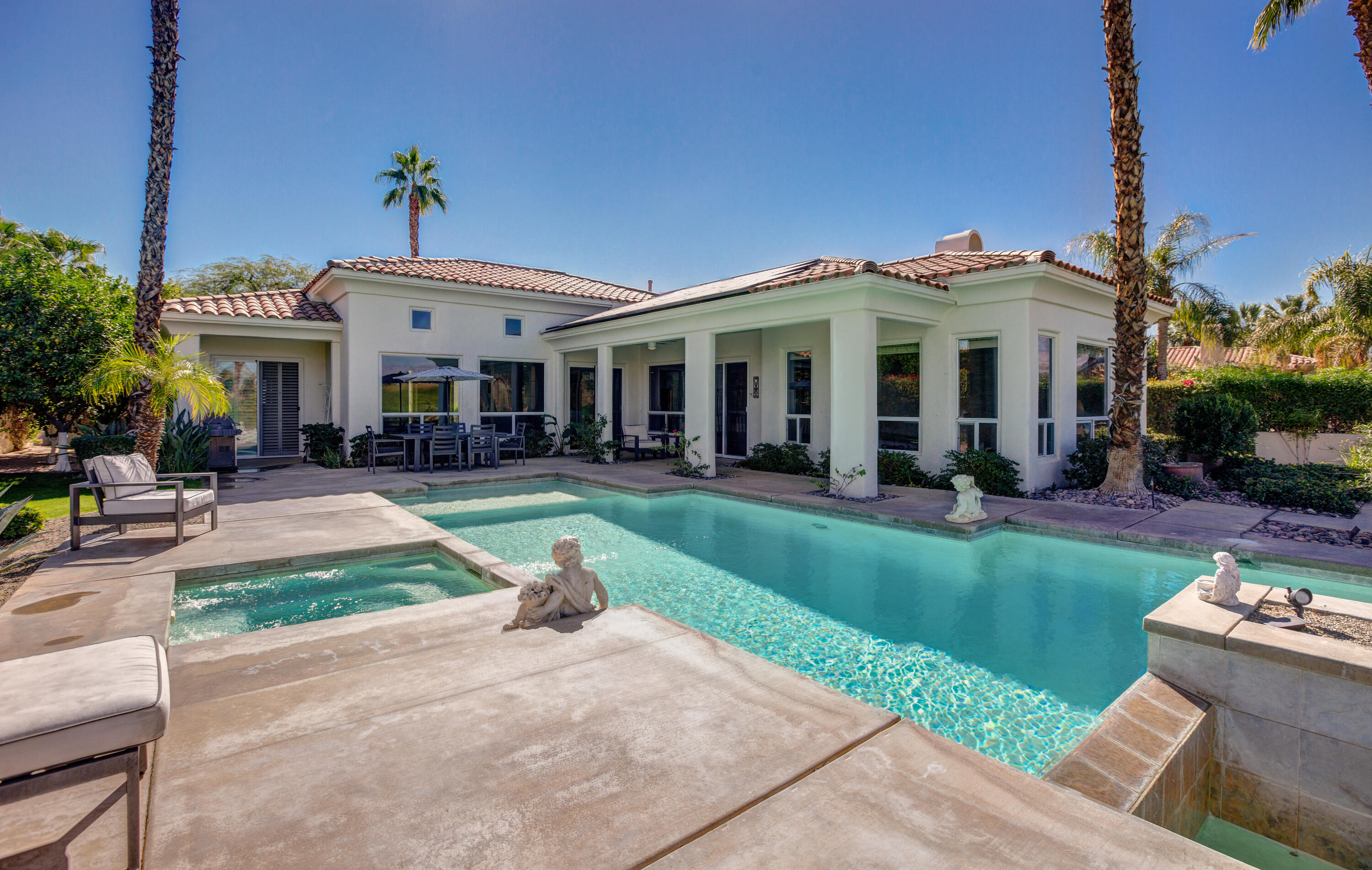 390 Loch Lomond Road Rancho Mirage, CA 92270 - Photo 2 of 55 a view of a house with a porch and furniture