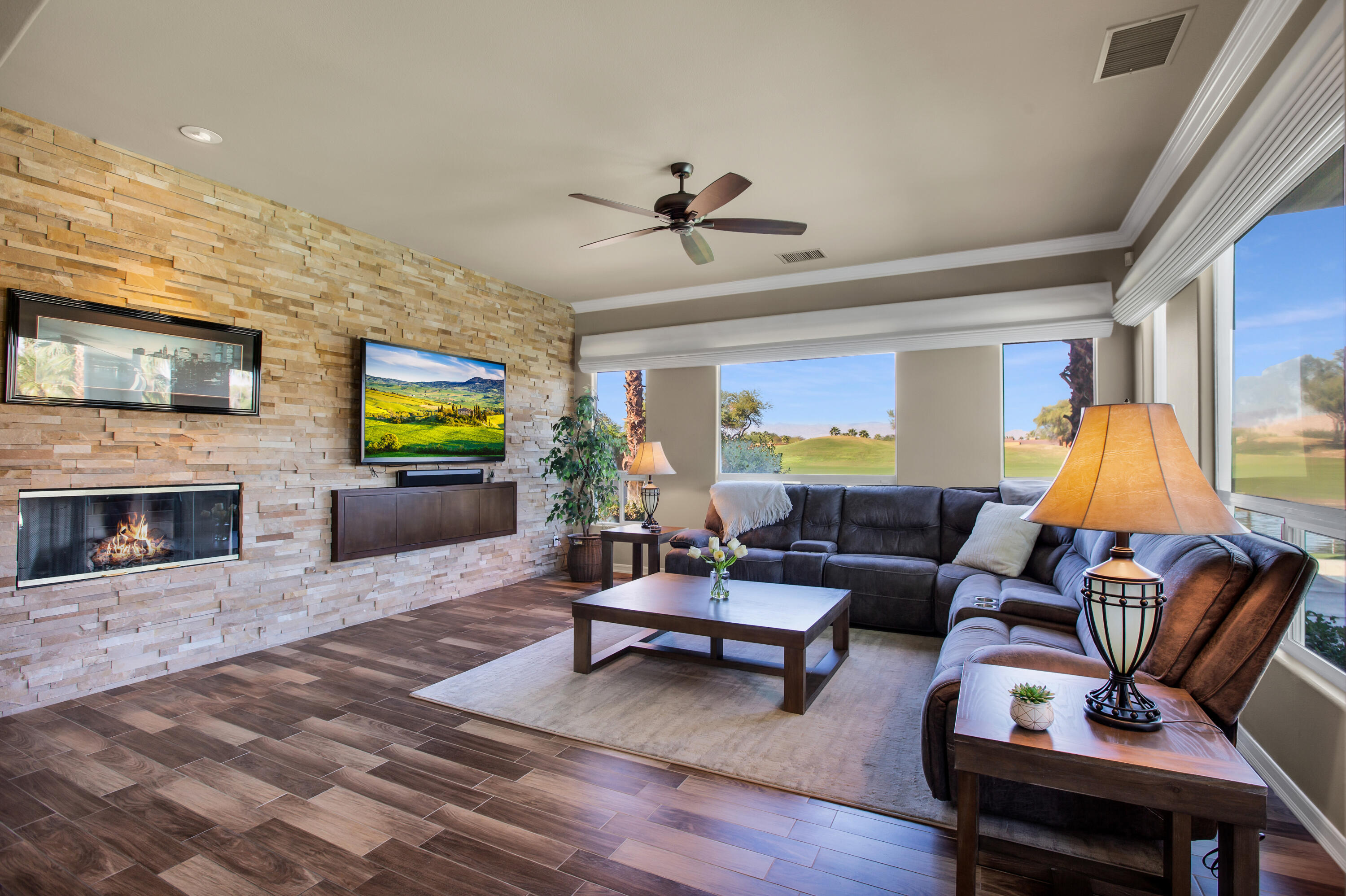 390 Loch Lomond Road Rancho Mirage, CA 92270 - Photo 12 of 55 a living room with furniture a fireplace and a flat screen tv