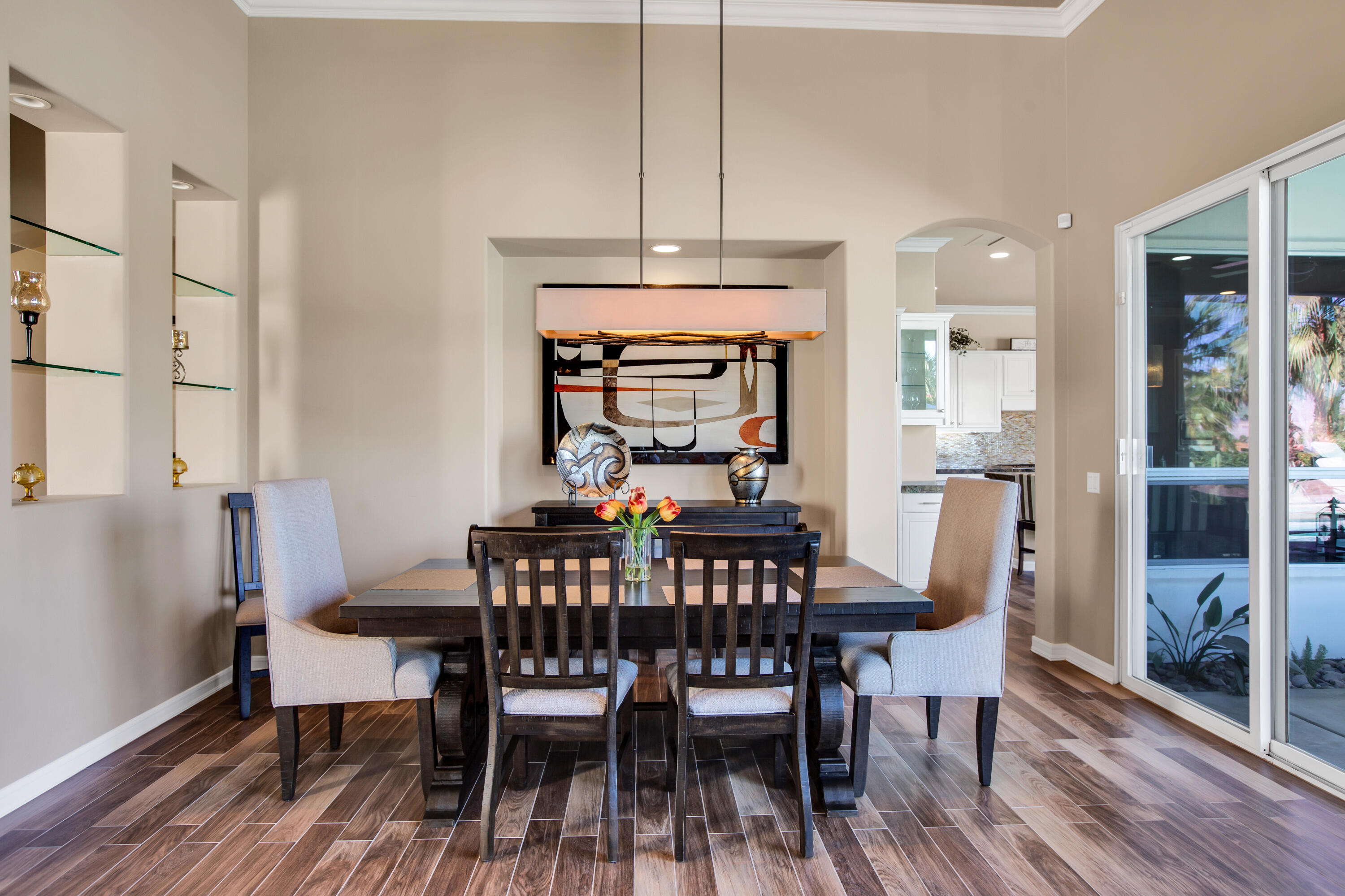 390 Loch Lomond Road Rancho Mirage, CA 92270 - Photo 23 of 55 a view of a dining room with furniture window and wooden floor