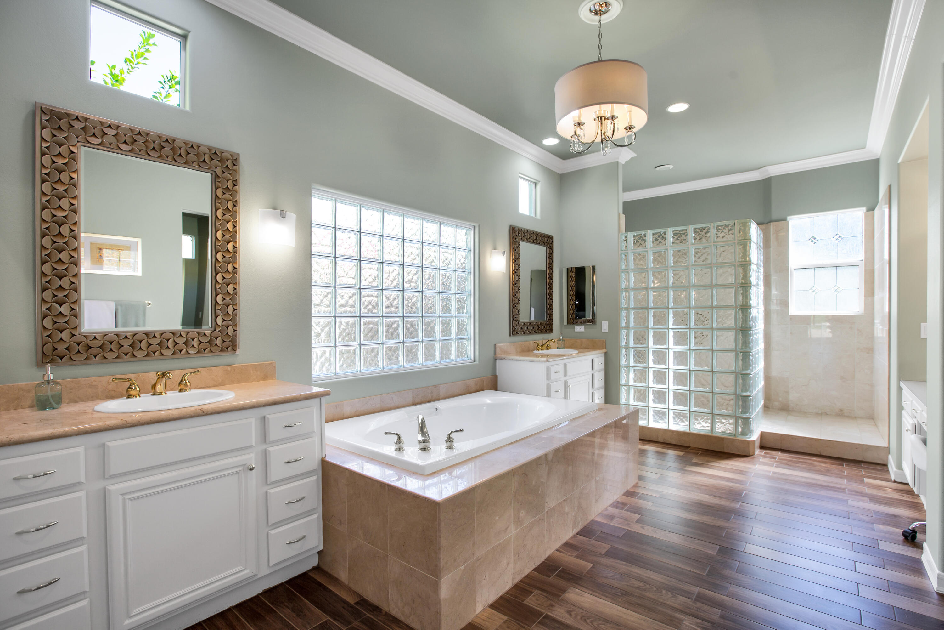 390 Loch Lomond Road Rancho Mirage, CA 92270 - Photo 27 of 55 a spacious bathroom with a sink a large mirror and a shower
