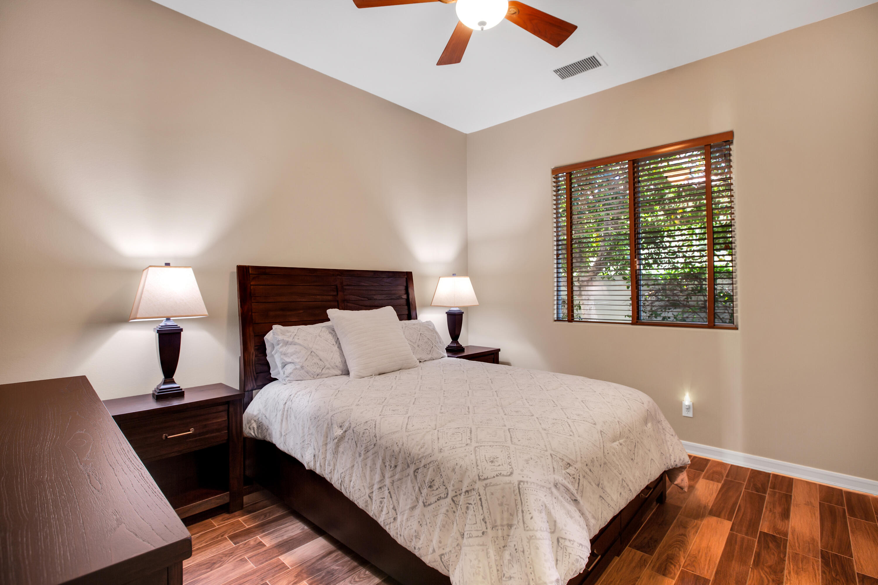 390 Loch Lomond Road Rancho Mirage, CA 92270 - Photo 32 of 55 a bedroom with a bed and a night stand