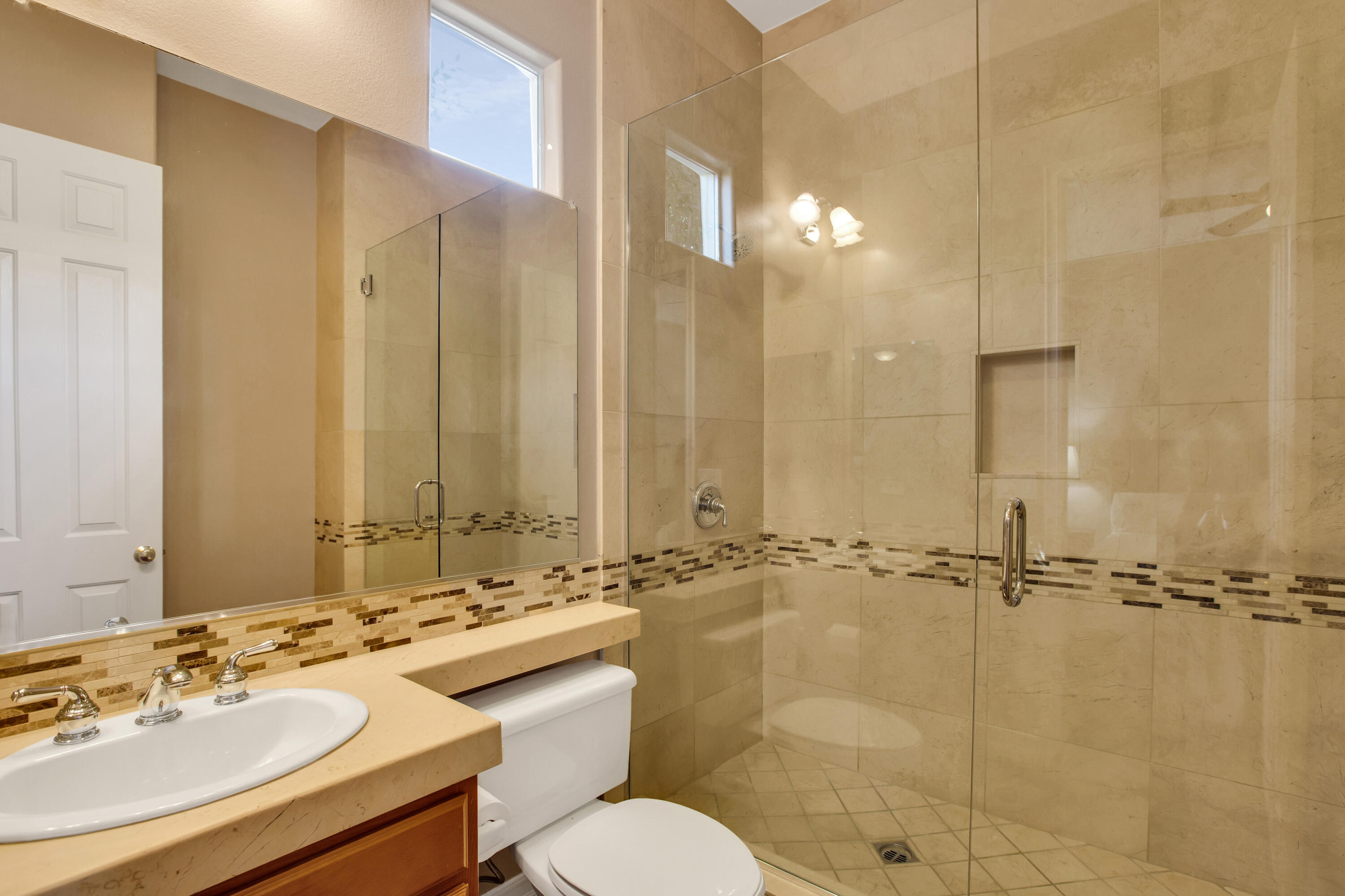 390 Loch Lomond Road Rancho Mirage, CA 92270 - Photo 34 of 55 a bathroom with a sink toilet and shower