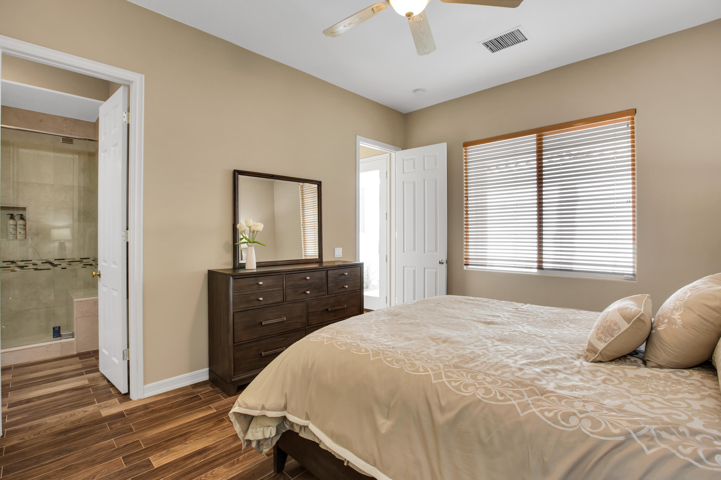390 Loch Lomond Road Rancho Mirage, CA 92270 - Photo 35 of 55 a bedroom with a bed and a dresser