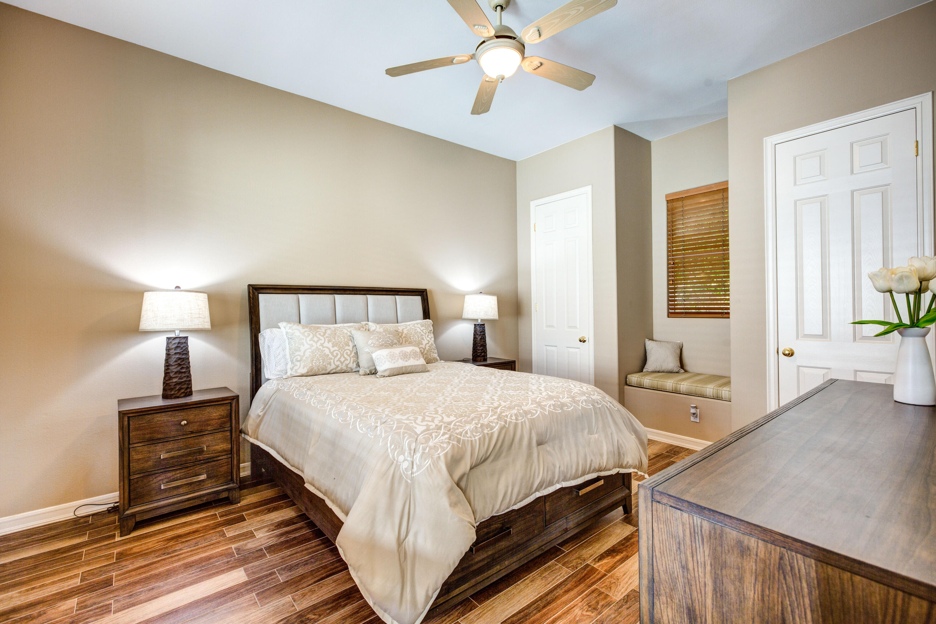 390 Loch Lomond Road Rancho Mirage, CA 92270 - Photo 36 of 55 a bedroom with a bed and wooden floor