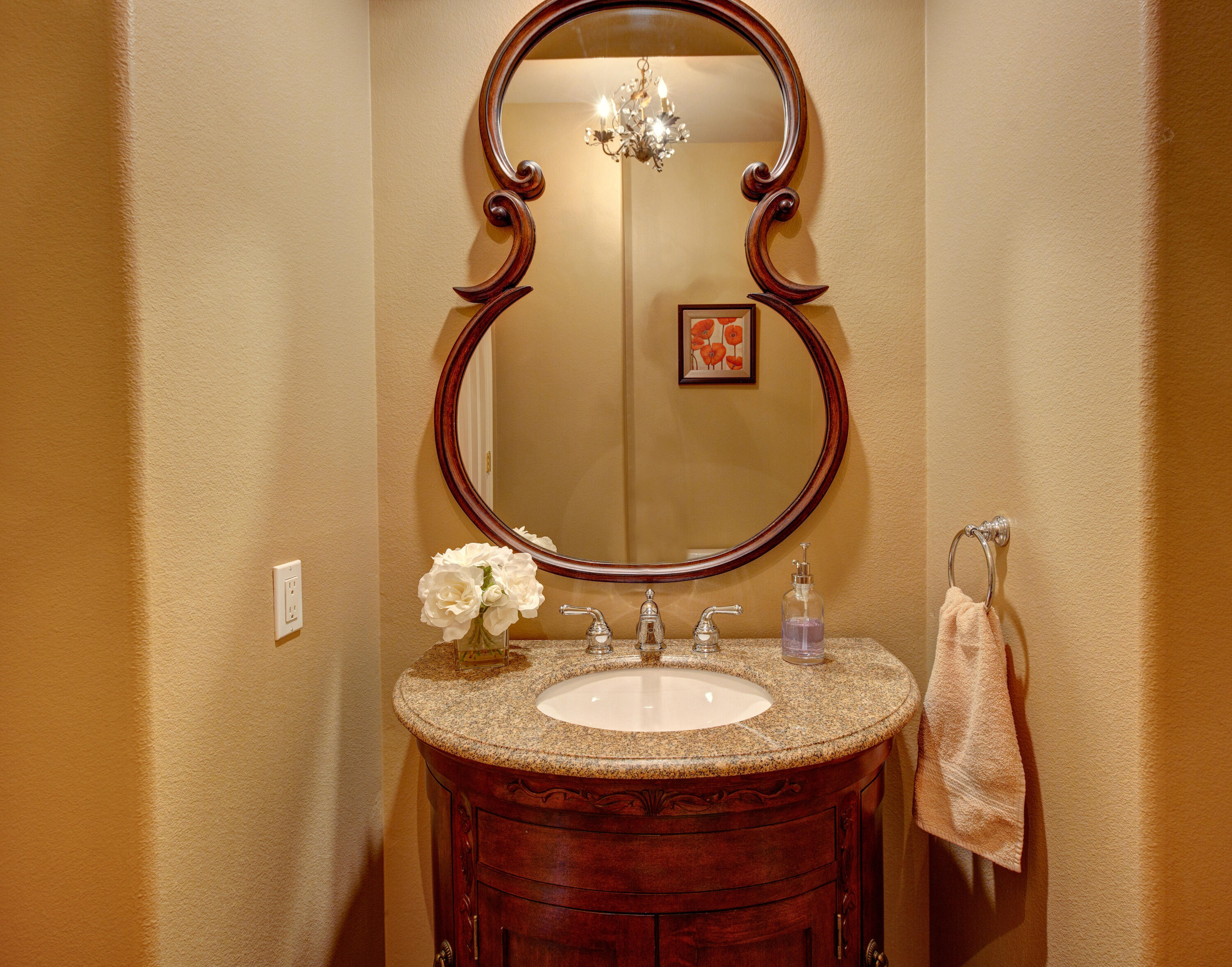 390 Loch Lomond Road Rancho Mirage, CA 92270 - Photo 38 of 55 a bathroom with a sink and a mirror