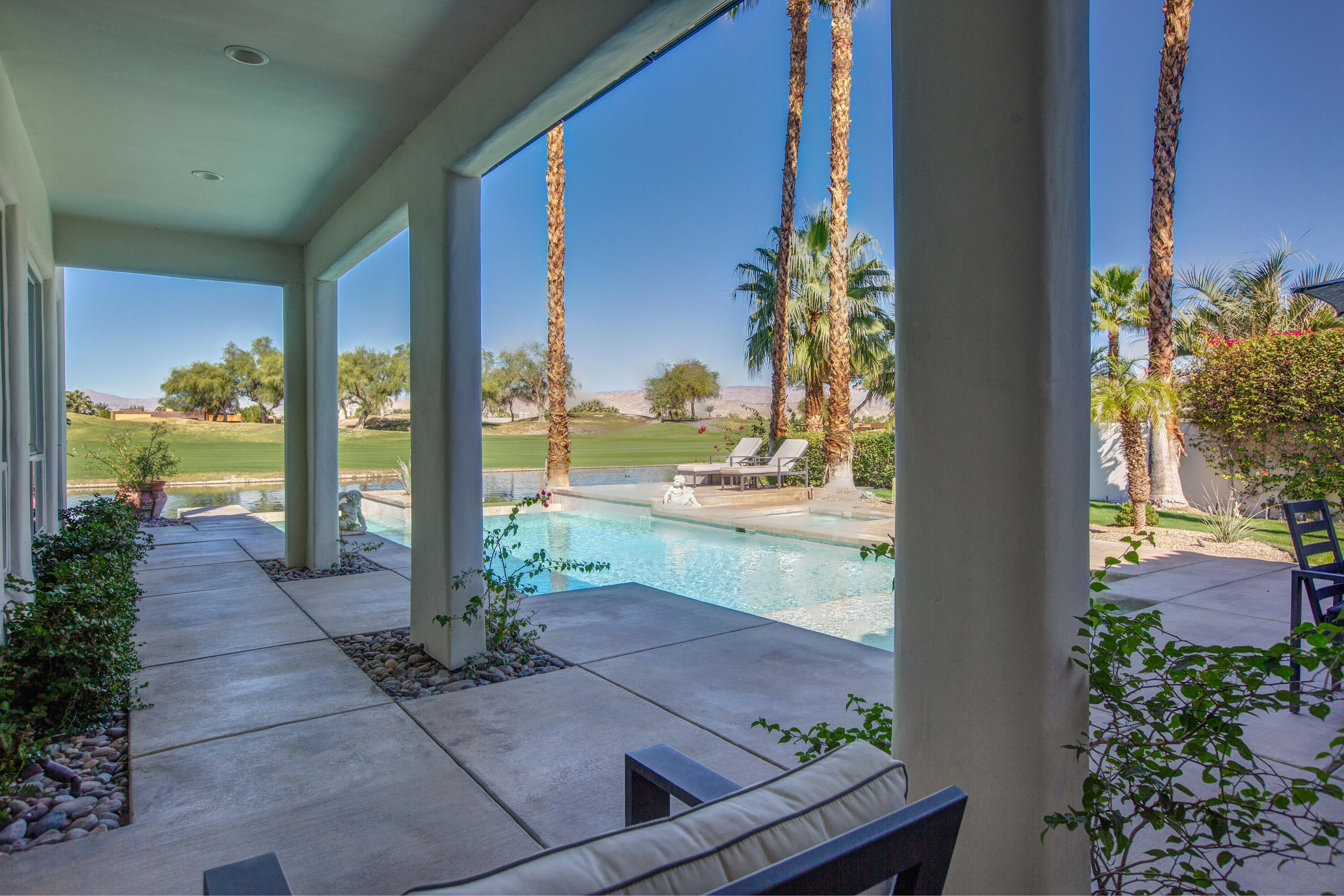 390 Loch Lomond Road Rancho Mirage, CA 92270 - Photo 41 of 55 a view of swimming pool with outdoor seating and plants