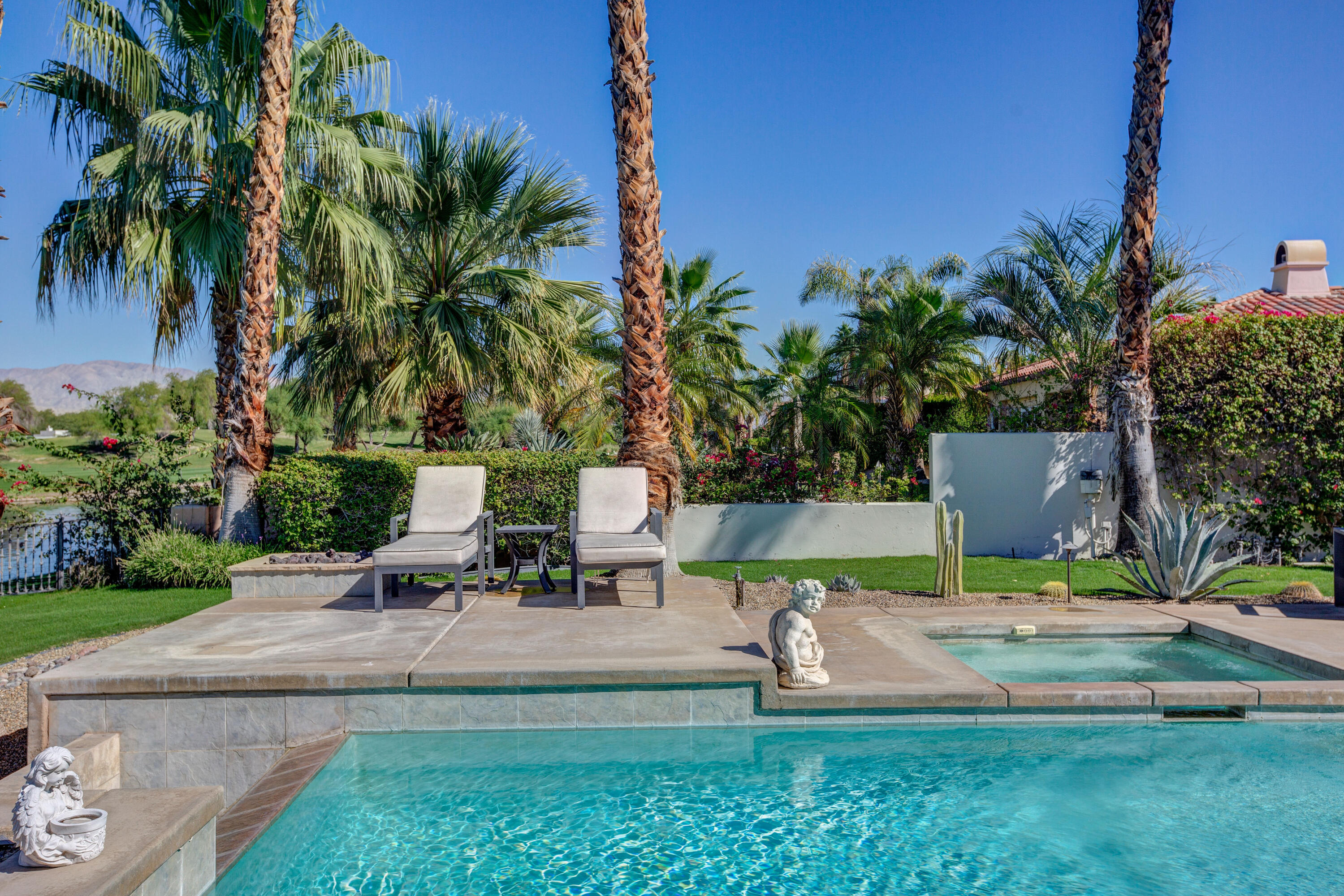 390 Loch Lomond Road Rancho Mirage, CA 92270 - Photo 49 of 55 a view of a yard with palm trees