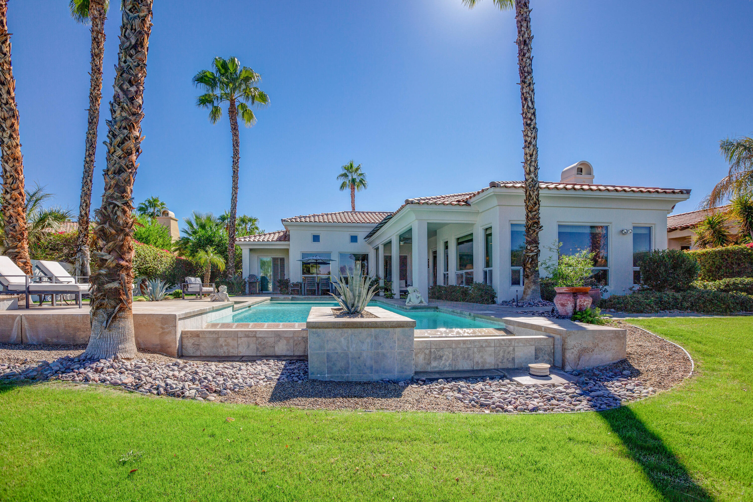 390 Loch Lomond Road Rancho Mirage, CA 92270 - Photo 51 of 55 a view of a house with a yard and sitting area