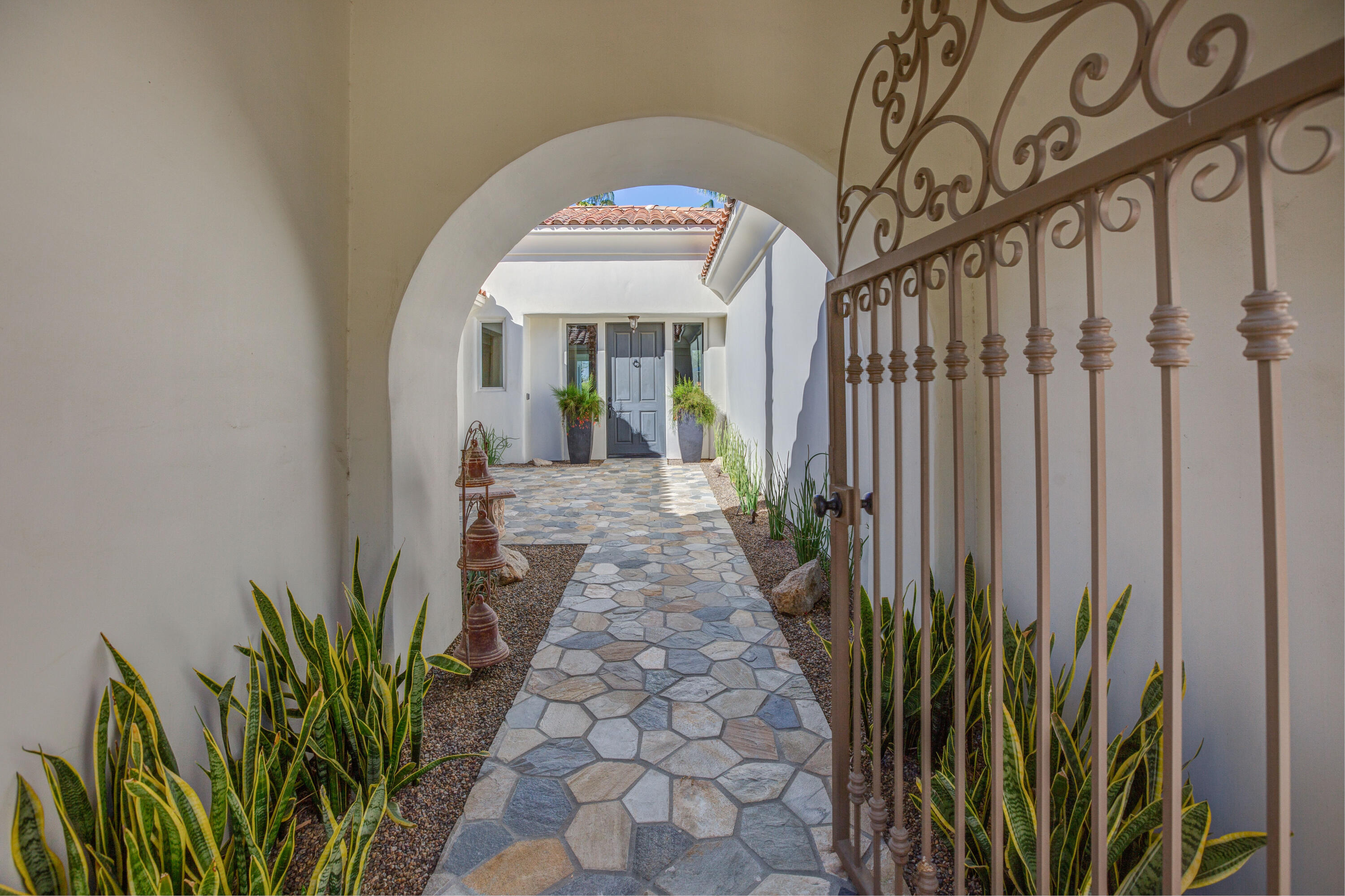 390 Loch Lomond Road Rancho Mirage, CA 92270 - Photo 8 of 55 a view of a bunch of flowers in a porch