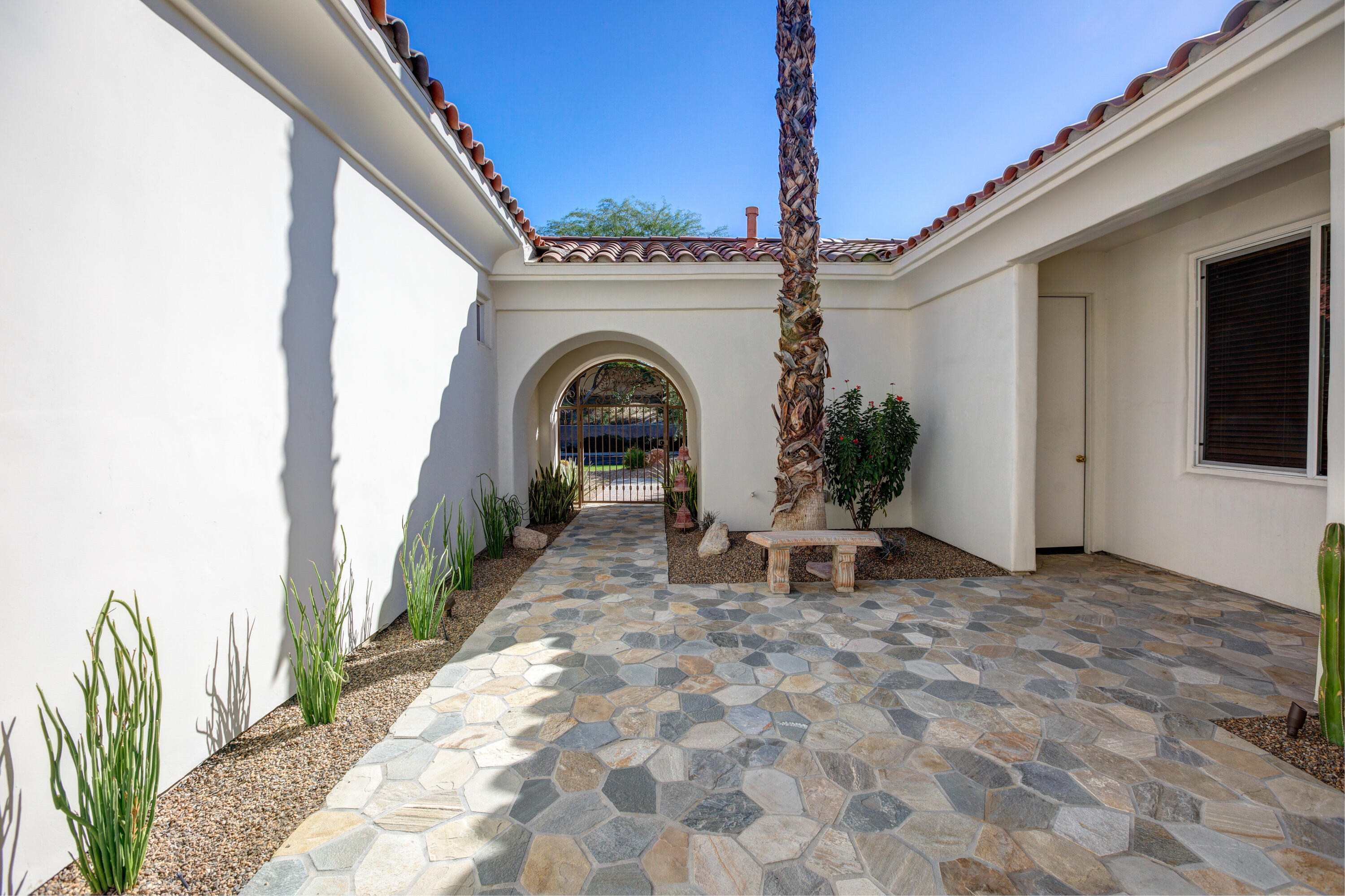 390 Loch Lomond Road Rancho Mirage, CA 92270 - Photo 10 of 55 a view of entryway with garden and patio