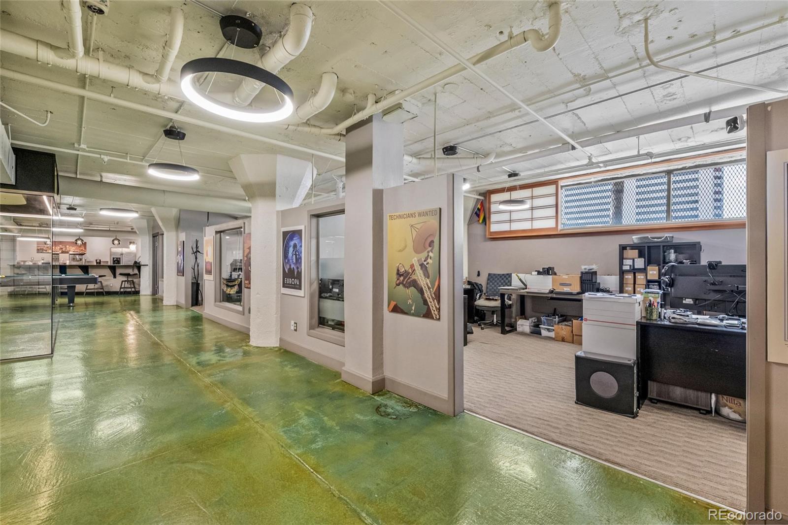 2000 Arapahoe Street, Unit 1 Denver, CO 80205 - Photo 20 of 32 a living room with lots of furniture and a kitchen view