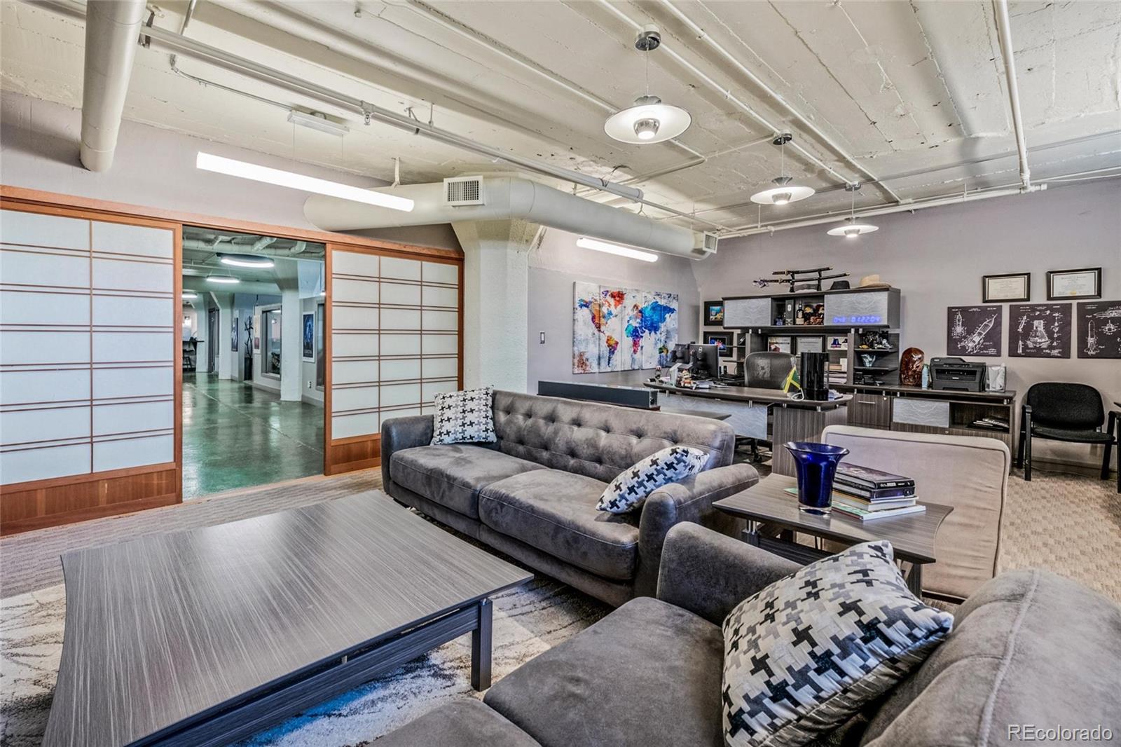 2000 Arapahoe Street, Unit 1 Denver, CO 80205 - Photo 6 of 32 a living room with furniture and a chandelier