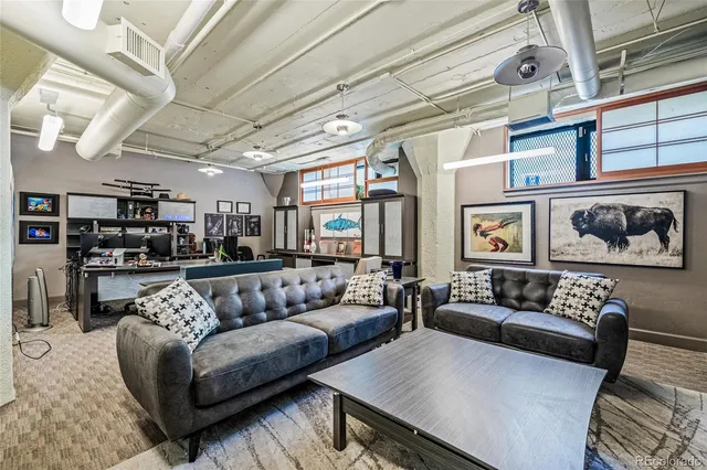 a kitchen with a stove a refrigerator and a dining table