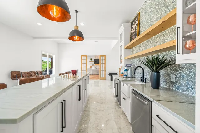 a bedroom with furniture and a ceiling fan