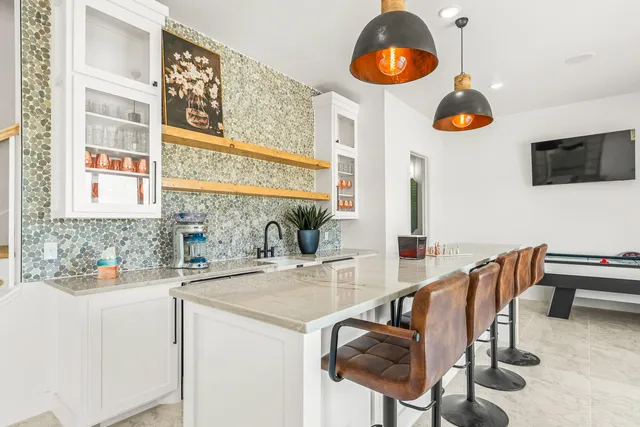 a kitchen with stainless steel appliances granite countertop a sink and cabinets