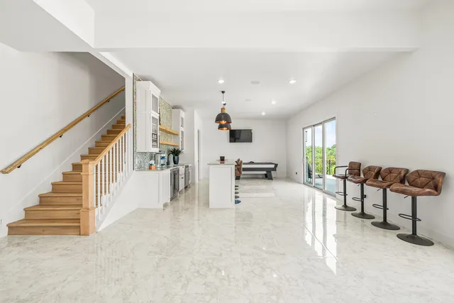 a kitchen with stainless steel appliances granite countertop a stove and cabinets