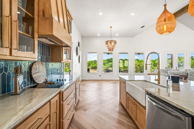 a bathroom with a granite countertop double vanity sink and a mirror