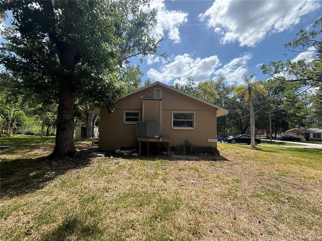 9029 Maiden Lane Aripeka, FL 34679 - Photo 9 of 11 a view of backyard of house with green space