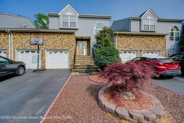 a view of a car park in front of house