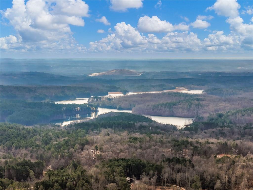 0 Eagles Perch Road Ball Ground, GA 30107 - Photo 23 of 28 a view of a lake with a yard