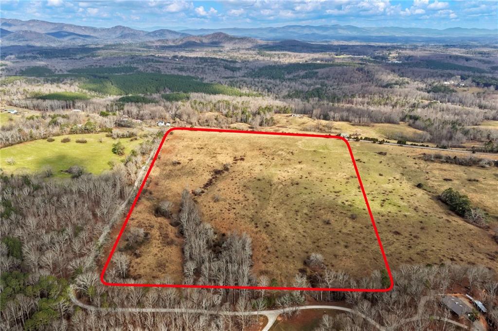 0 Eagles Perch Road Ball Ground, GA 30107 - Photo 27 of 28 a view of a lake with a mountain