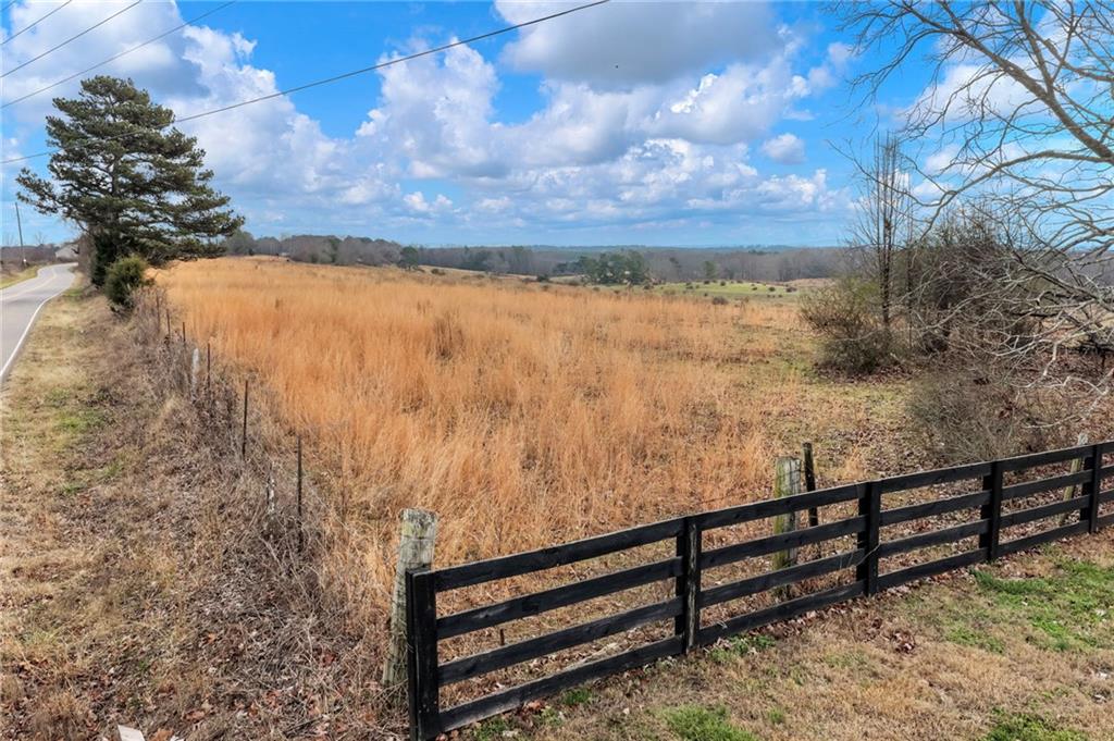 0 Eagles Perch Road Ball Ground, GA 30107 - Photo 3 of 28 a view of a yard with wooden fence