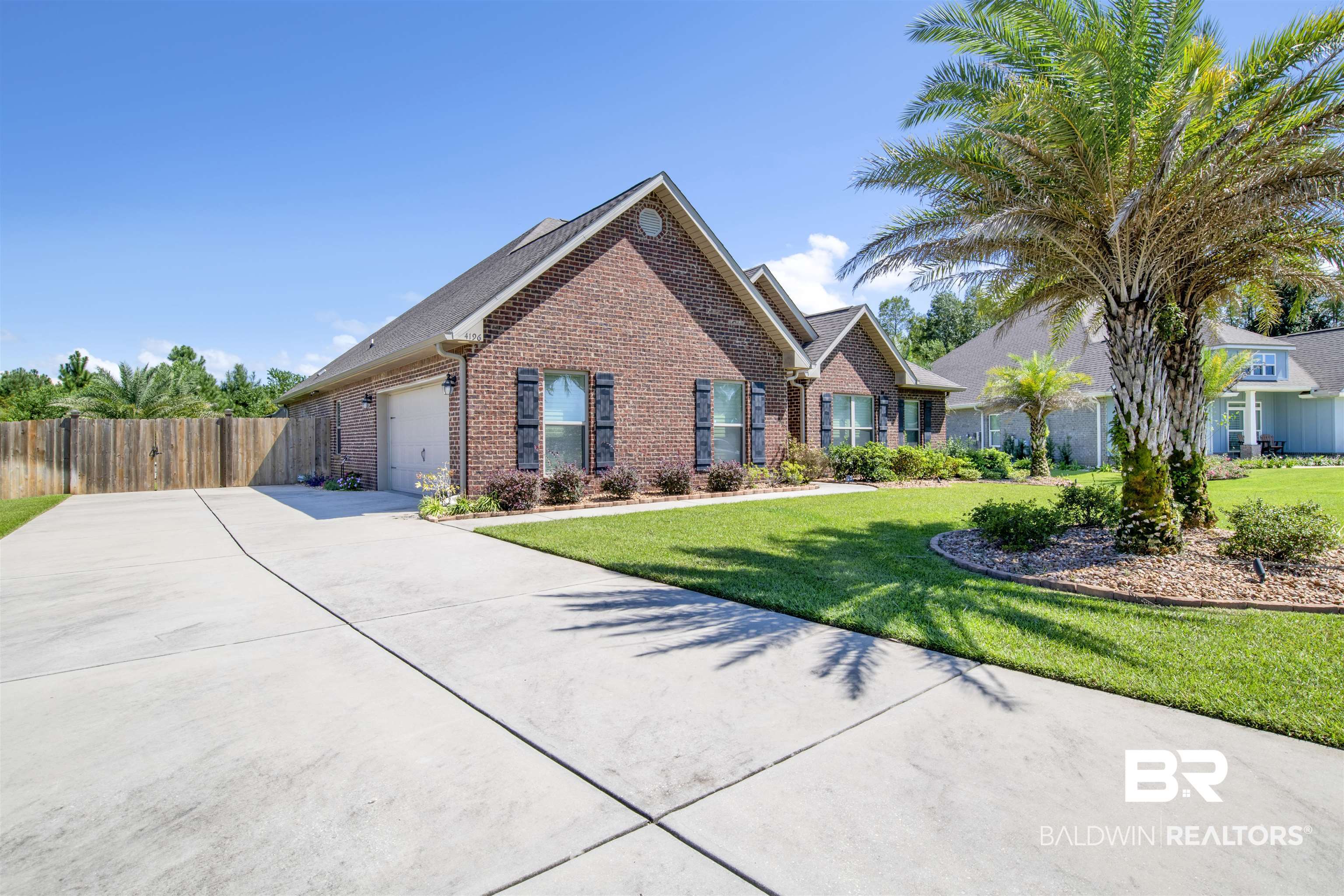 4196 Inverness Circle Gulf Shores, AL 36542 - Photo 4 of 43 View of front of home featuring a front lawn
