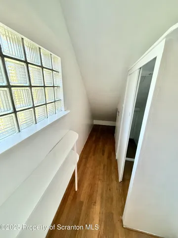 a view of entryway with wooden floor