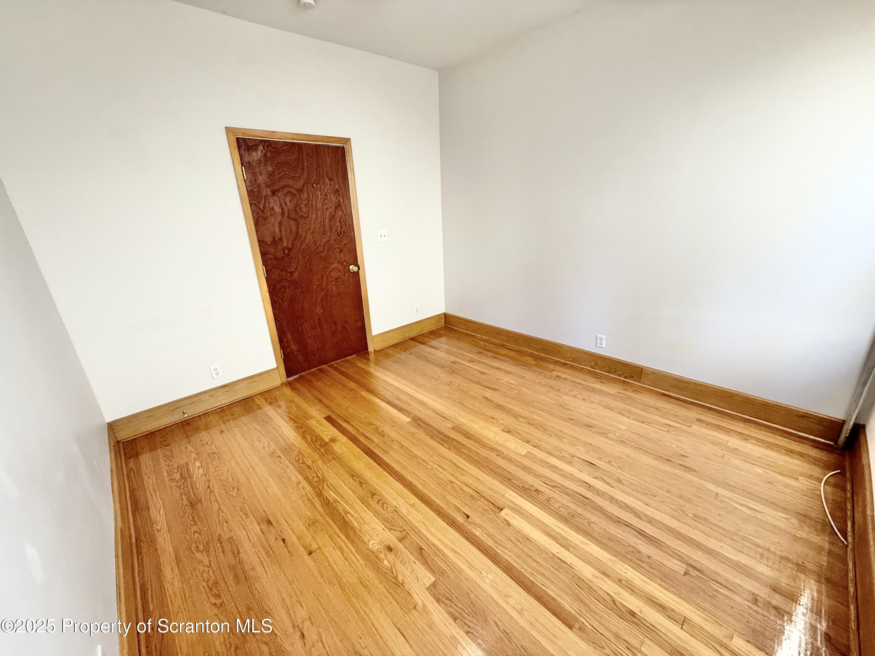 1012 North Webster Avenue, Unit FIRST Scranton, PA 18510 - Photo 17 of 23 a view of empty room with wooden floor