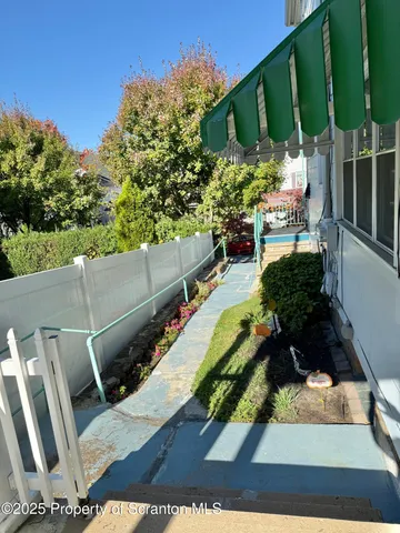 a view of a backyard with sitting area