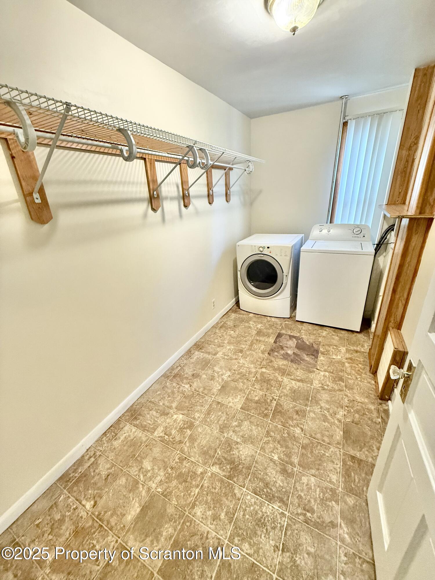 1012 North Webster Avenue, Unit FIRST Scranton, PA 18510 - Photo 10 of 23 a room with a door and a white wooden floor