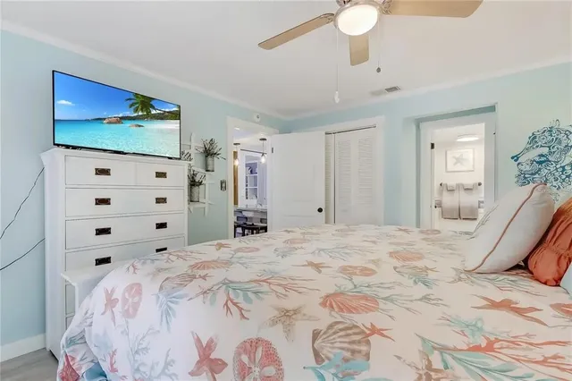 a bedroom with a large bed and a dresser