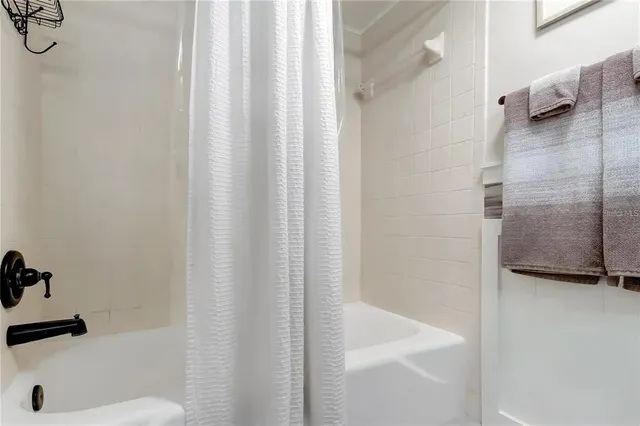 a view of a swimming pool with chairs in patio