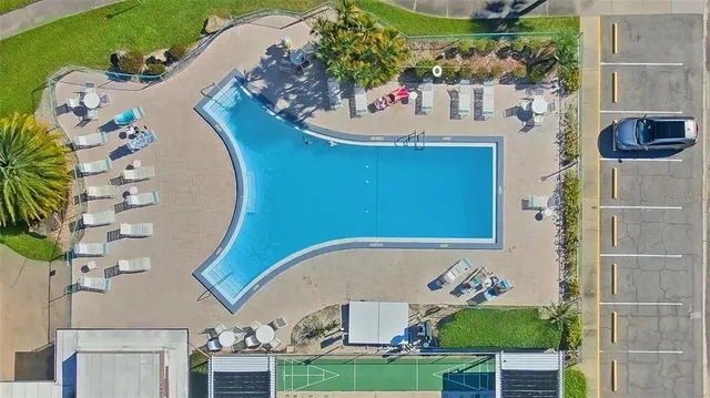 a view of a dining room with furniture and a potted plant