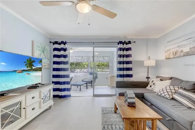 a living room with furniture cabinets and window