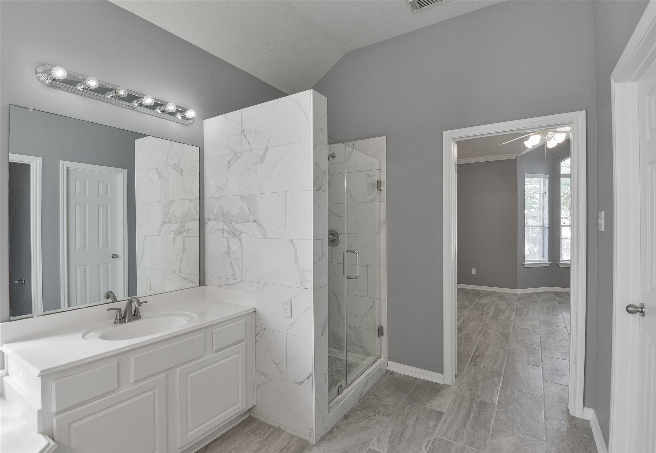 18411 Atasca Wds Trace Humble, TX 77346 - Photo 22 of 39 a bathroom with a double vanity sink mirror and shower