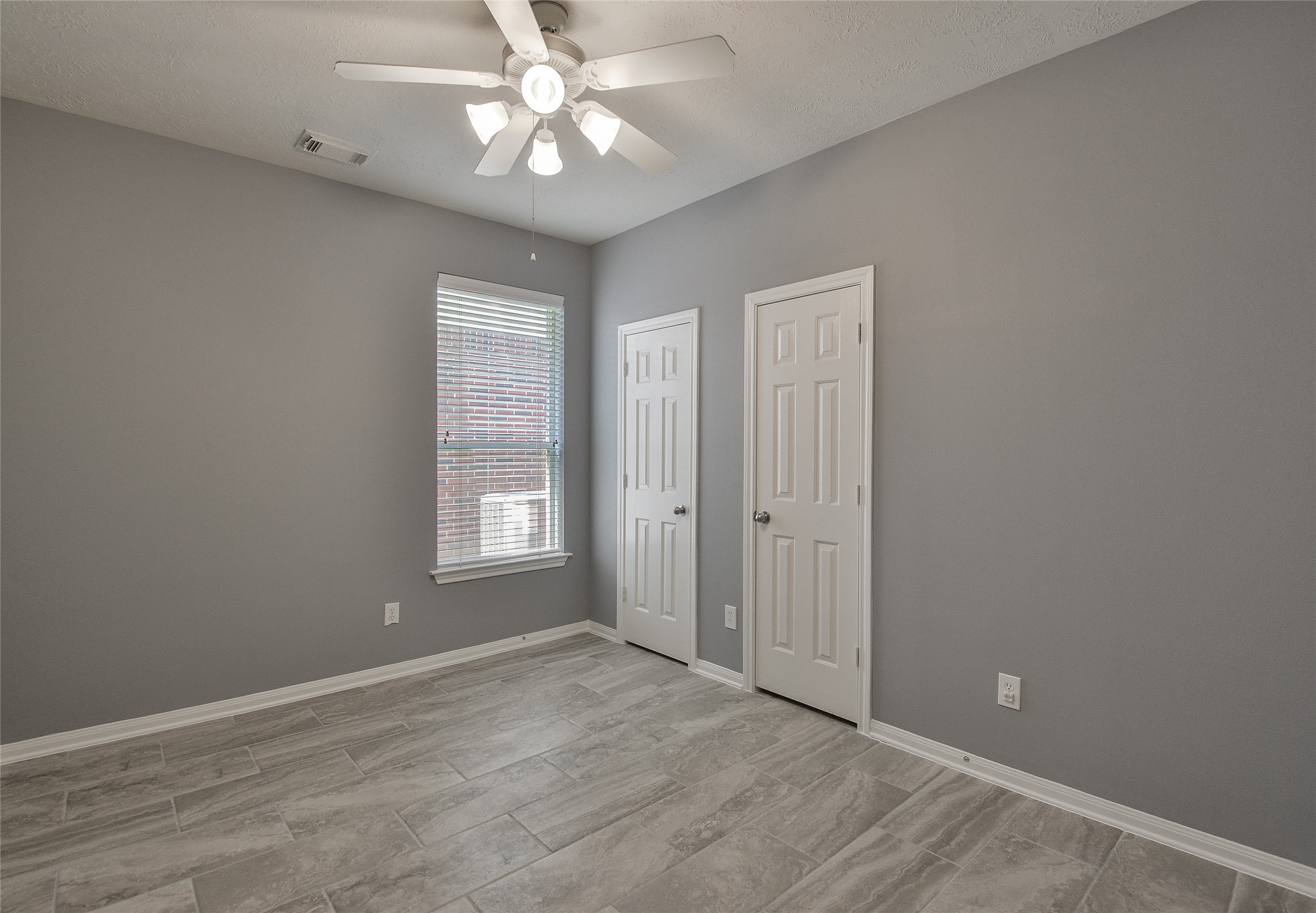 18411 Atasca Wds Trace Humble, TX 77346 - Photo 26 of 39 wooden floor in an empty room with a window