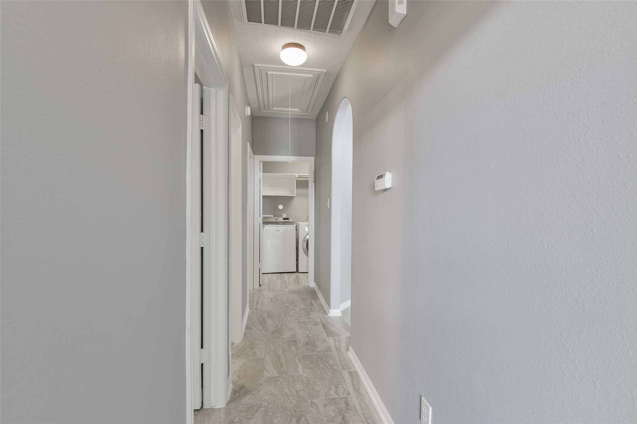 18411 Atasca Wds Trace Humble, TX 77346 - Photo 31 of 39 a view of a hallway with wooden floor