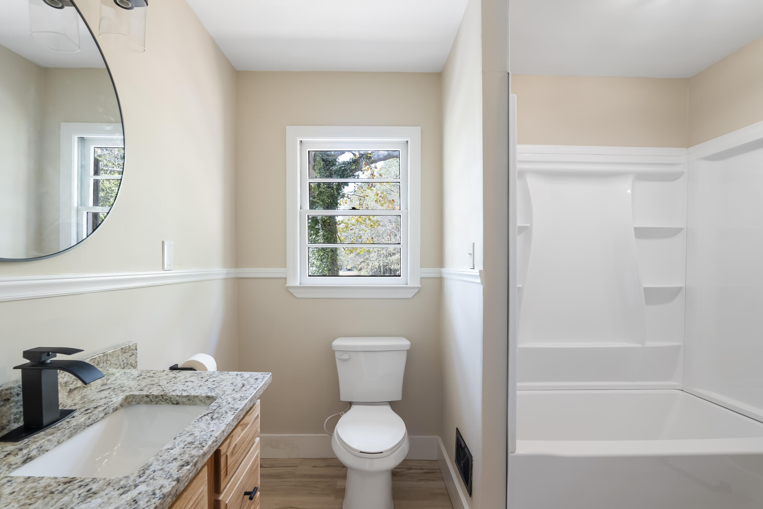 39 Gantt Street Wagener, SC 29164 - Photo 19 of 30 a bathroom with a granite countertop sink toilet and shower