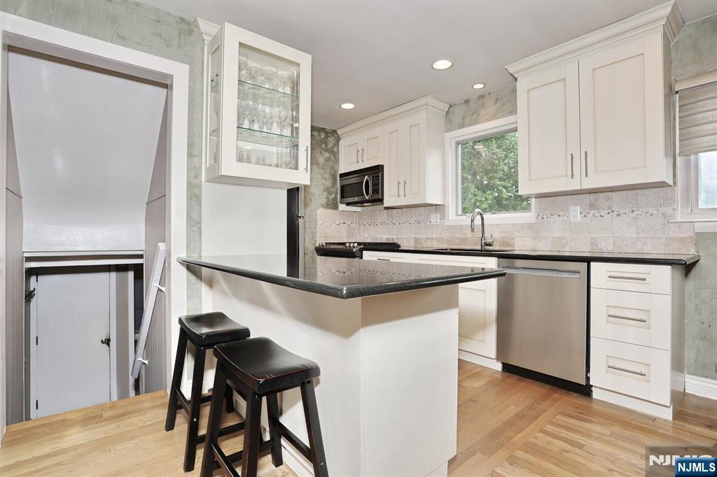 87 Barbara Road Dumont, NJ 07628 - Photo 16 of 48 a kitchen with a sink cabinets and window
