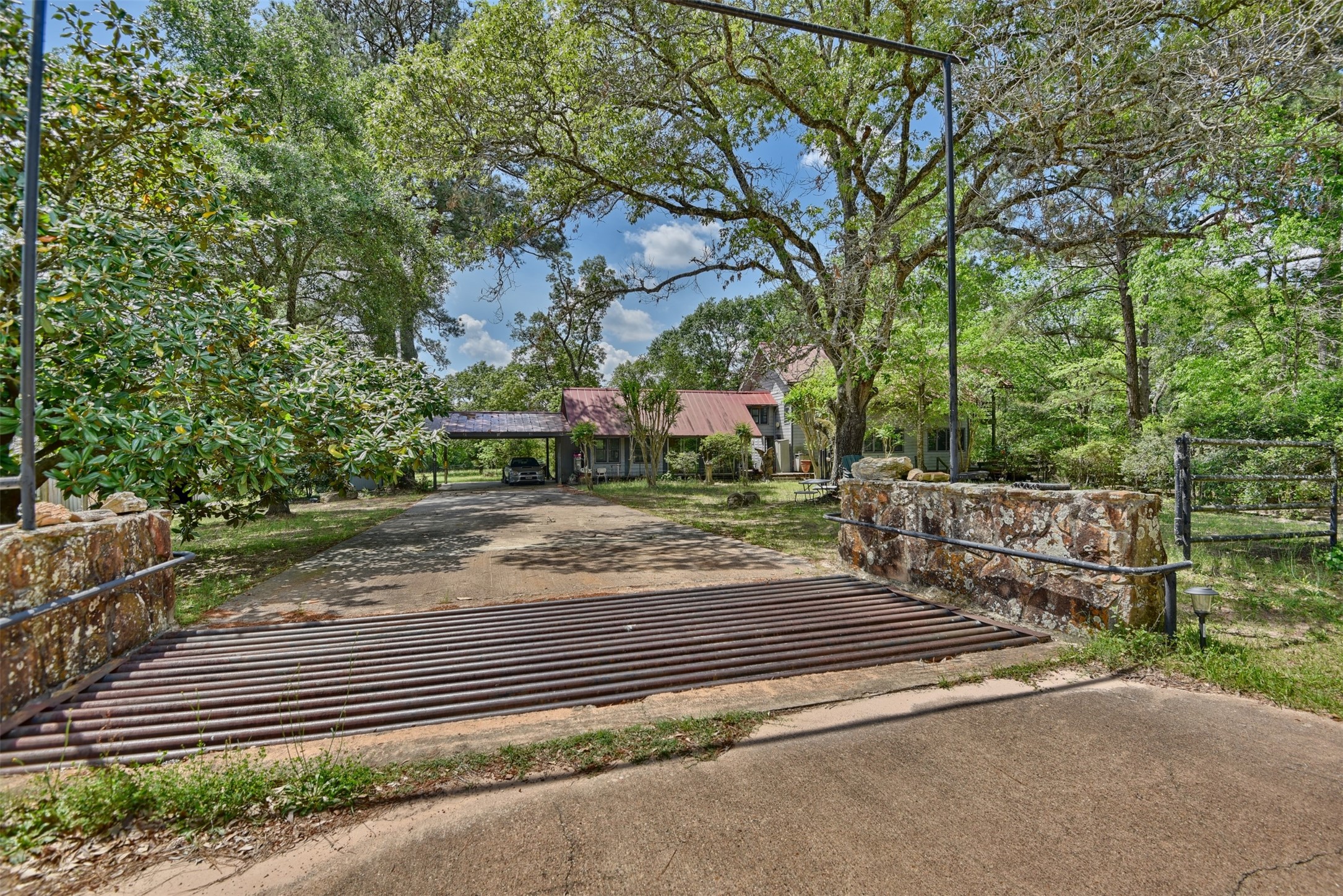 32023 Courtney Road Navasota, TX 77868 - Photo 30 of 37 a view of a yard and car parked