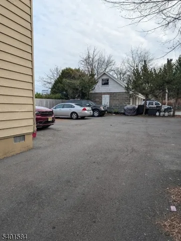 a view of car parked in front of house