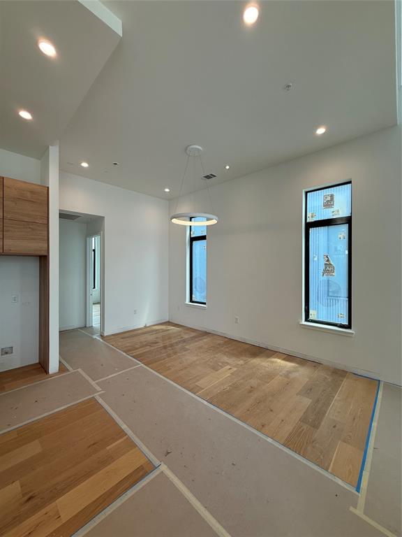 1111 Raiford Road, Unit 101 Carrollton, TX 75007 - Photo 14 of 26 a view of an empty room with windows and cabinet